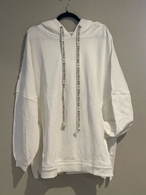 We the Free White oversized drawstring hoody with front pockets.